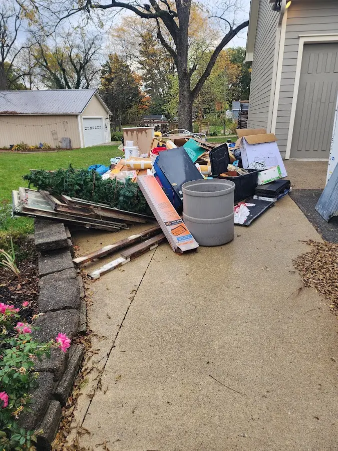 Dumpster being loaded with debris for 12 Yard Dumpster Rental in Jennings Lodge